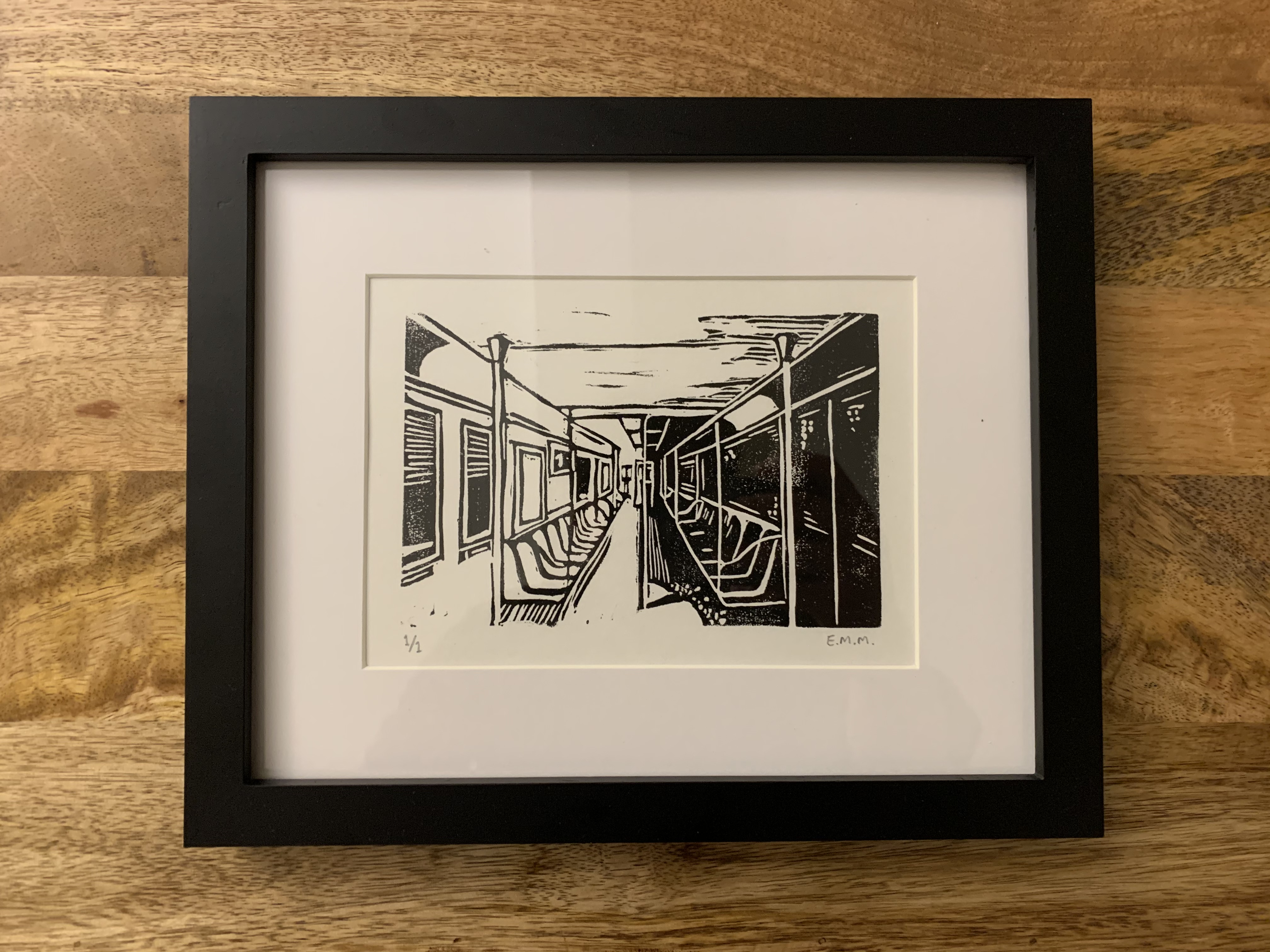 Linocut of NYC 1 train by E.M. Merricks